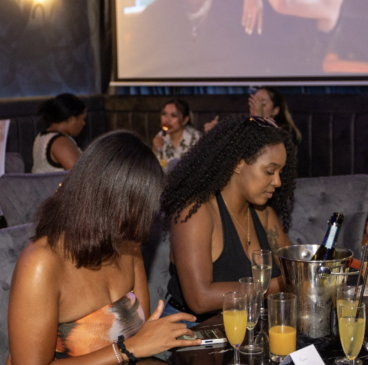 Photo from an event where multiple women are shown