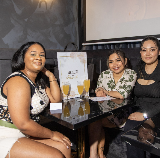 Photo from an event where two women look into the camera